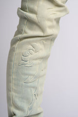 "LOVE IS PAIN" EMBOSSED SKINNY DENIM (LIGHT BLUE/SAND)